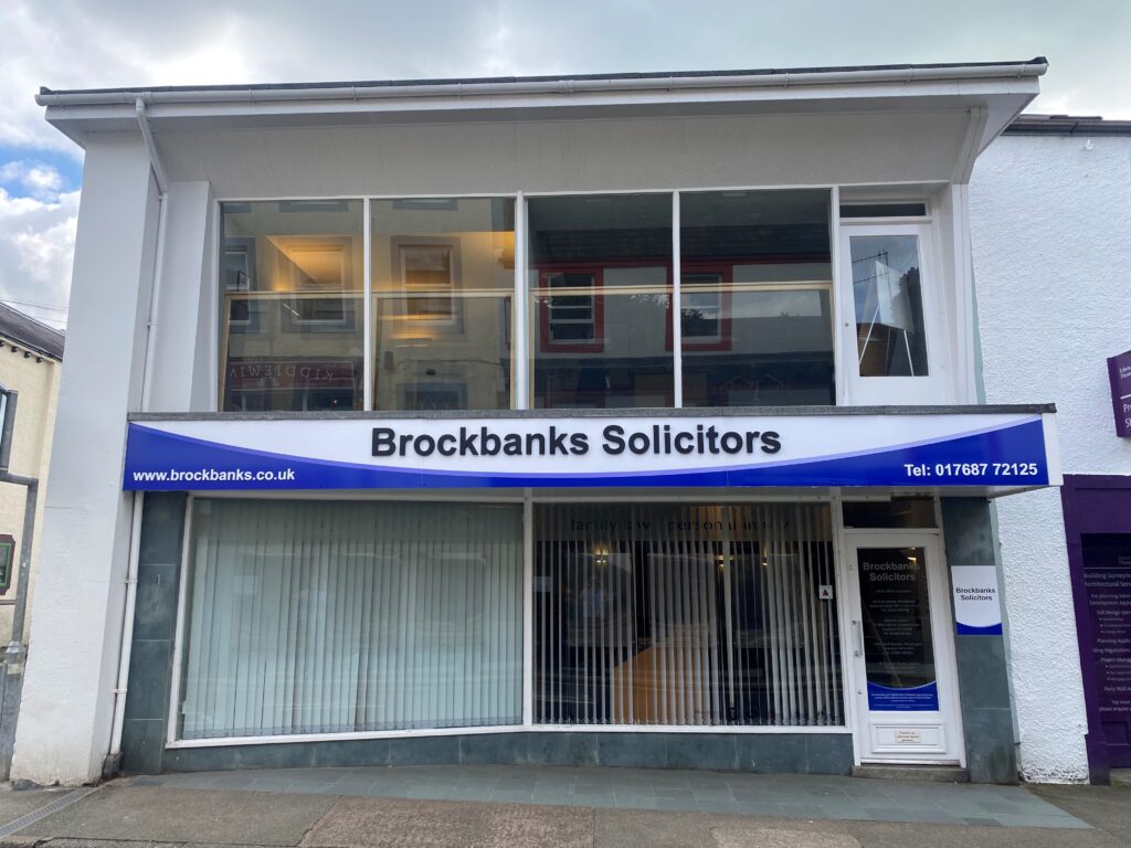 The Brockbanks Solicitors office in Keswick, with blue shopfront signage